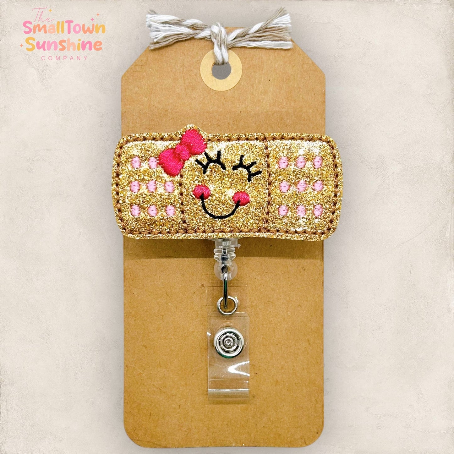 Adhesive Bandage with Bow Badge Reel - pink: Clear / Swivel