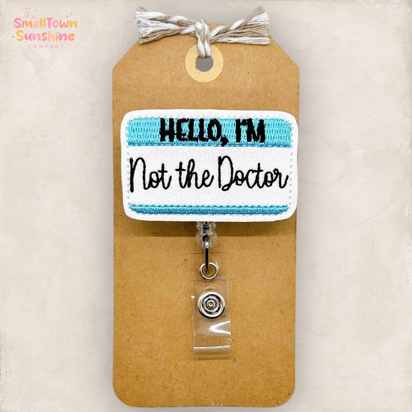 Hello, I'm Not the Doctor Badge Reel (blue): Black / Swivel
